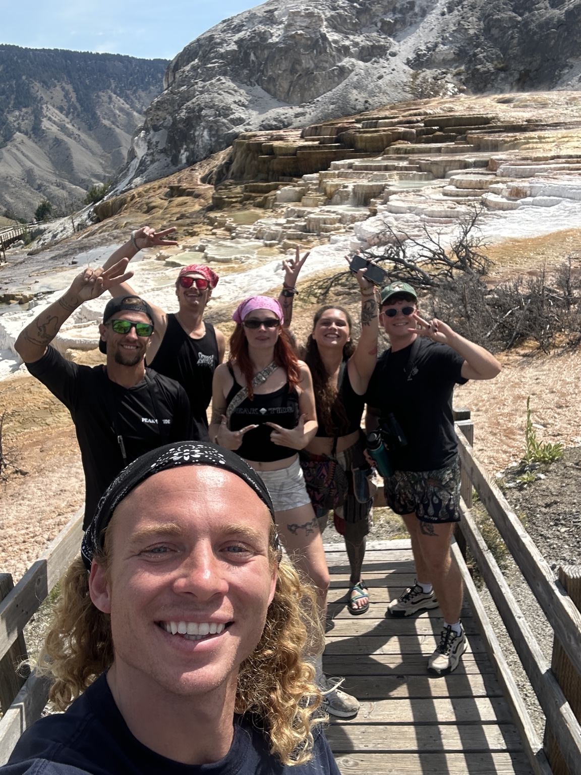 Theo taking a group selfie at Mammoth Hot Springs